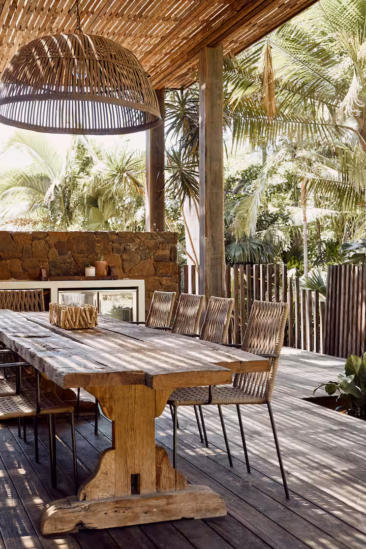 The stone outdoor kitchen and dining table
